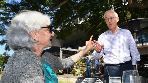 Malcolm Turnbull with Longman resident Toni Lea at Sandstone Point, Queensland. Picture: AAP
