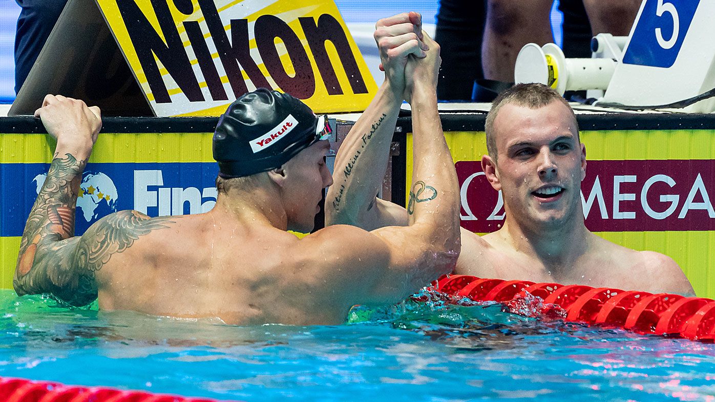 Kyle Chalmers congratulates Caleb Dressel