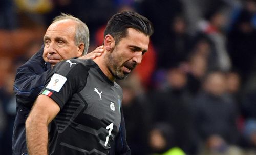 Buffon is comforted by Italian head coach Gian Piero Ventura. (AAP)