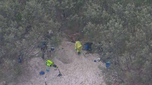 A man remains in an intensive care unit, fighting for life after he fell into a hole and was buried by sand on Bribie Island in Queensland.The 25-year-old man is critical but stable at Brisbane's Princess Alexandra Hospital after the freak accident.