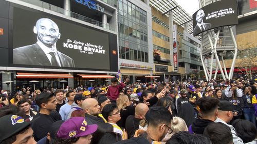 Thousands of fans mourn the loss of Kobe Bryant with makeshift memorials in front of the Staples Centre.