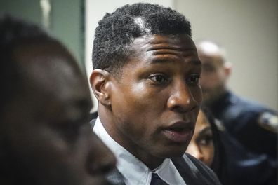 Jonathan Majors, left, returns to court after a lunch break in his domestic assault trial, Tuesday, Dec. 5, 2023, in New York. (AP Photo/Bebeto Matthews)