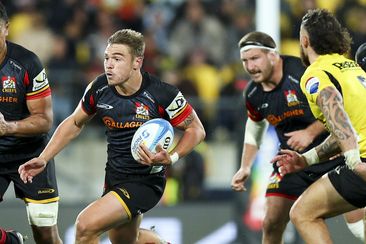 Cortez Ratima of the Chiefs on attack during the Super Rugby Pacific semi-final match.