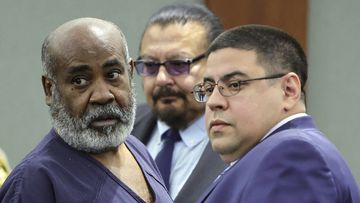 Duane &quot;Keffe D&quot; Davis, left, with deputy special public defenders Robert Arroyo, right, and Charles Cano, rear, appears for his arraignment at the Regional Justice Center, Nov. 2, 2023, in Las Vegas.