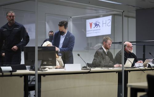 Irmgard Furchner, accused of being part of the apparatus that helped the Nazis' Stutthof concentration camp function, sits behind a screen, at the court for the verdict in her trial in Itzehoe, Germany, Tuesday, Dec. 20, 2022.