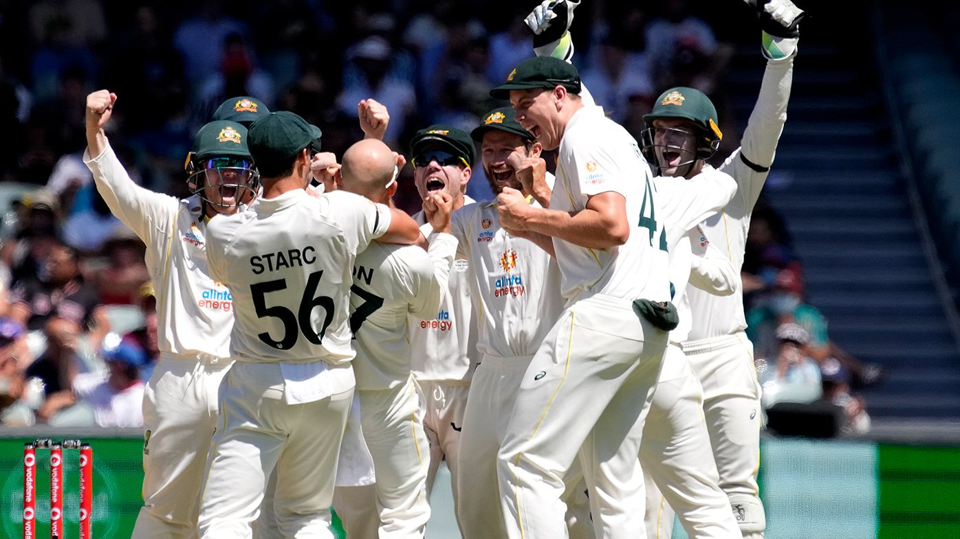 Australian players celebrate a wicket on their way to victory in the second Ashes Test in Adelaide.