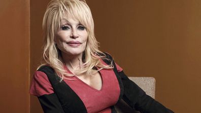 FILE - Dolly Parton poses at the Carnegie Medal of Philanthropy Ceremony in New York, on Oct. 13, 2022. Carl Dean, Dolly Parton's husband of nearly 60 years, died Monday, March 3, 2025, in Nashville, Tenn., at age 82. (AP Photo/Andres Kudacki, File)