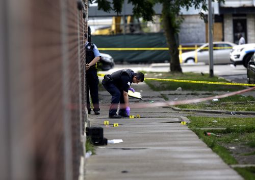 Chicago Police officers and detectives investigate a shooting where multiple people were shot on Sunday, August 5, 2018 in Chicago, Illinois. (Getty)