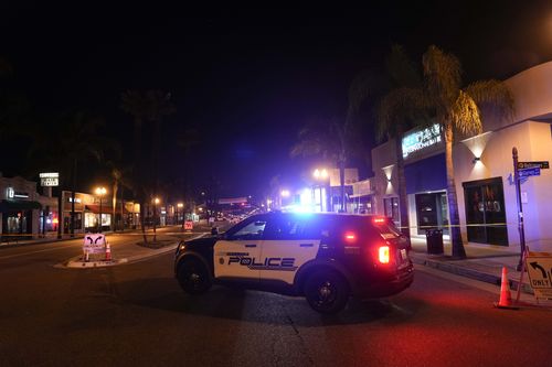 A police vehicle is seen near a scene where a shooting took place in Monterey Park, Calif., Sunday, Jan. 22, 2023. Dozens of police officers responded to reports of a shooting that occurred after a large Lunar New Year celebration had ended in a community east of Los Angeles late Saturday. (AP Photo/Jae C. Hong)