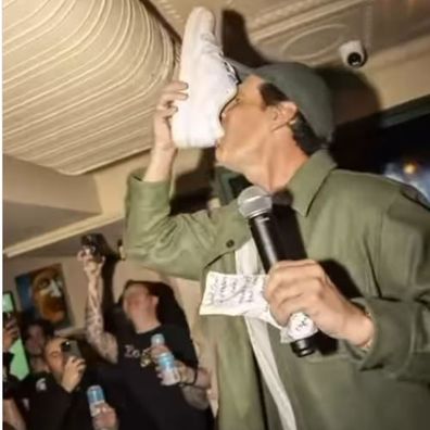 Andy Lee doing a shoey at the opening of Old Mates bar in New York