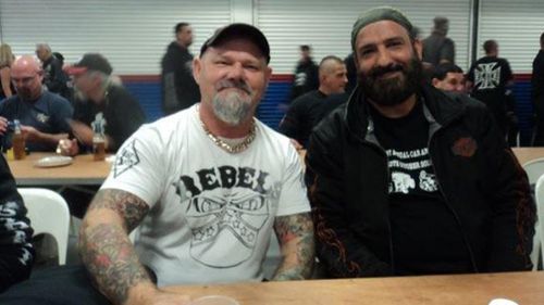 Martin Place siege gunman Man Monis, right, with a member of the Rebels motorcycle gang, during a club outing, in an image tendered to the siege inquest. (Supplied)