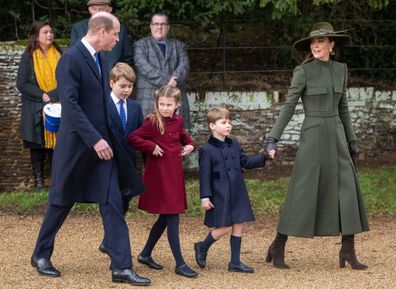 SANDRINGHAM, NORFOLK - DECEMBER 25:  Prince William, Prince of Wales, Prince George, Princess Charlotte, Prince Louis and Catherine, Princess of Wales attend the Christmas Day service at Sandringham Church on December 25, 2022 in Sandringham, Norfolk. King Charles III ascended to the throne on September 8, 2022, with his coronation set for May 6, 2023. (Photo by Samir Hussein/WireImage)