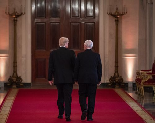 Trump walks away with Vice-President Mike Pence after the chaotic conference.