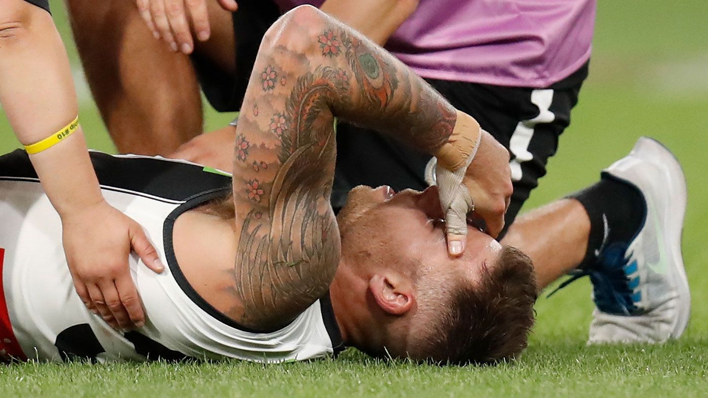 Jamie Elliott of the Magpies lays injured during the 2021 AFL Round 2 match between the Carlton Blues and the Collingwood Magpies at the Melbourne Cricket Ground.