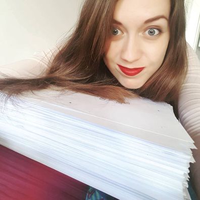 Samantha Shannon with the manuscript for The Priory of the Orange Tree.
