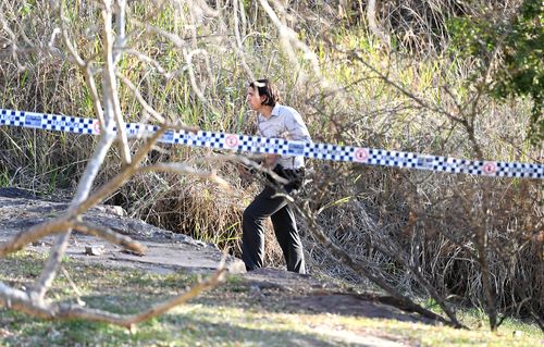 The remains were discovered by a passer-by in long grass near the popular riverside parkland area overlooking the city on Monday.

