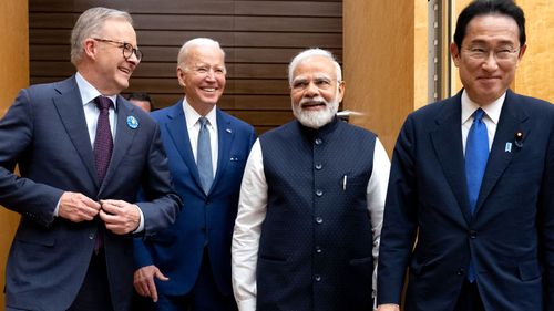 Anthony Albanese walks with US President Joe Biden, Indian Prime Minister Narendra Modi and Japanese Prime Minister Fumio Kishida, the host of the 2022 Quad summit.