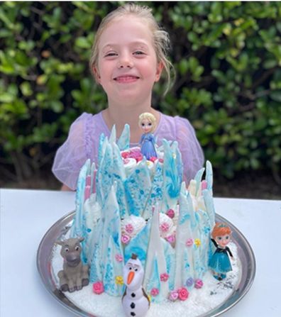 Pearl with her incredible Frozen cake.