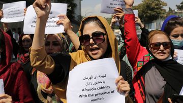 Women gather to demand their rights under the Taliban rule during a protest in Kabul, Afghanistan.