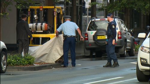 Police assess evidence at the scene in Bondi Junction.