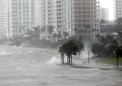 Waves crash over a seawall at the mouth of the Miami River from Biscayne Bay as Hurricane Irma passes by. (AP)