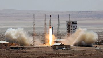 A handout picture released by Iran's Defence Ministry on shows a Simorgh (Phoenix) satellite rocket at its launch site at an undisclosed location in Iran. (AFP)