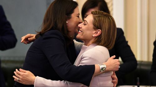 Premier Annastacia Palszczuk and Treasurer Jackie Trad embrace after Ms Trad delivered her Budget speech. (AAP)