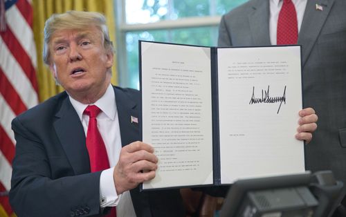 Today, Trump shockingly signed a Presidential order allowing children to stay with their parents if caught crossing the border illegally. Picture: AAP.