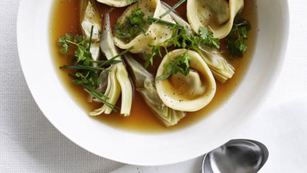 Chicken brodo with artichoke tortellini and spring herbs