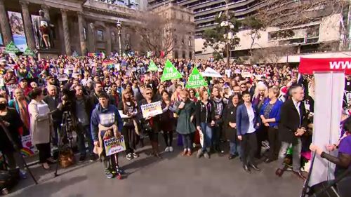 Protesters gathered outside the State Library in Swanston Street before marching to parliament on Spring Street. (9NEWS)