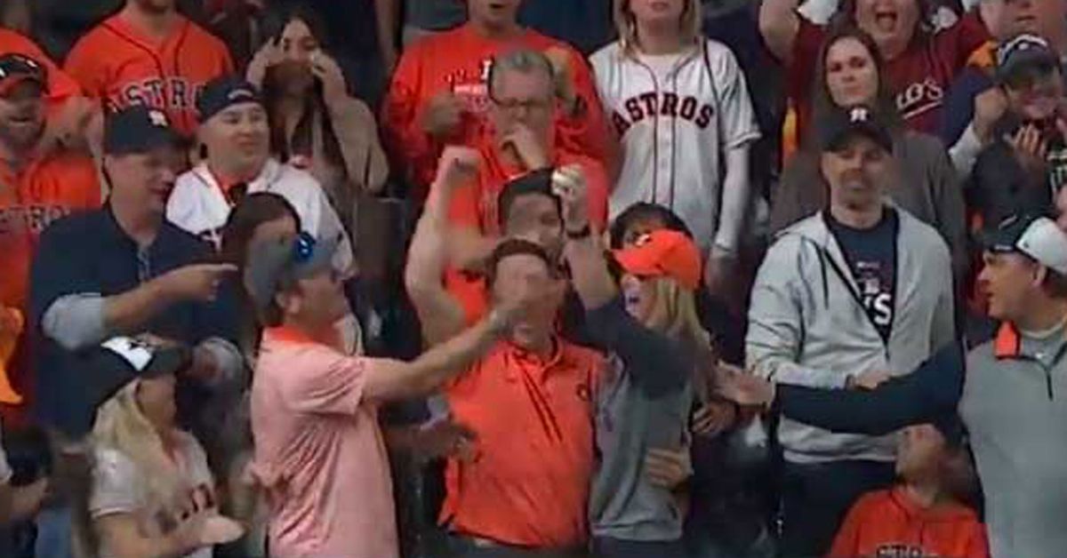 An Aggressive Red Sox fan rips a home run ball from female's hands