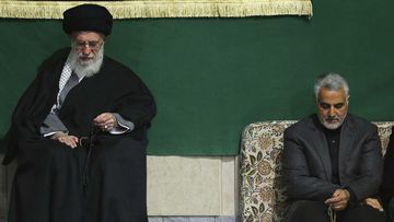 The commander of Iran&#x27;s Quds Force, Qassem Soleimani, right, sits next to the Supreme Leader Ayatollah Ali Khamenei.