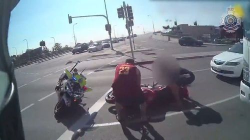 The motorcyclist allegedly rammed into the parked police bike before he attempted to run up the street away from the officer.