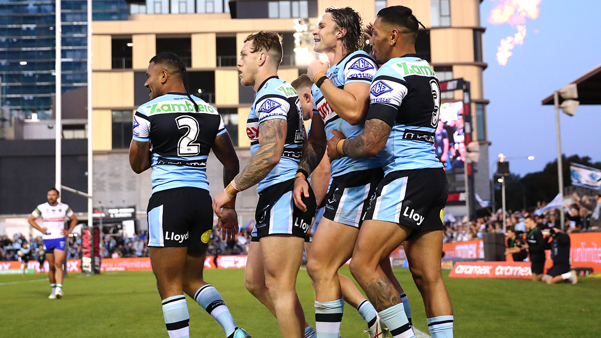 Sione Katoa celebrates scoring a try with teammates during the round 27 NRL match between Cronulla Sharks and Canberra Raiders at PointsBet Stadium.