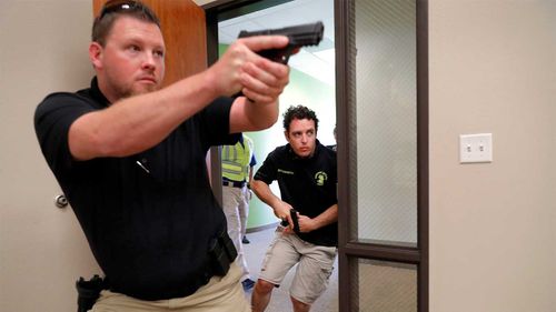Participants in a Texas training program that teaches civilians how to fight back against mass shootings in churches.
