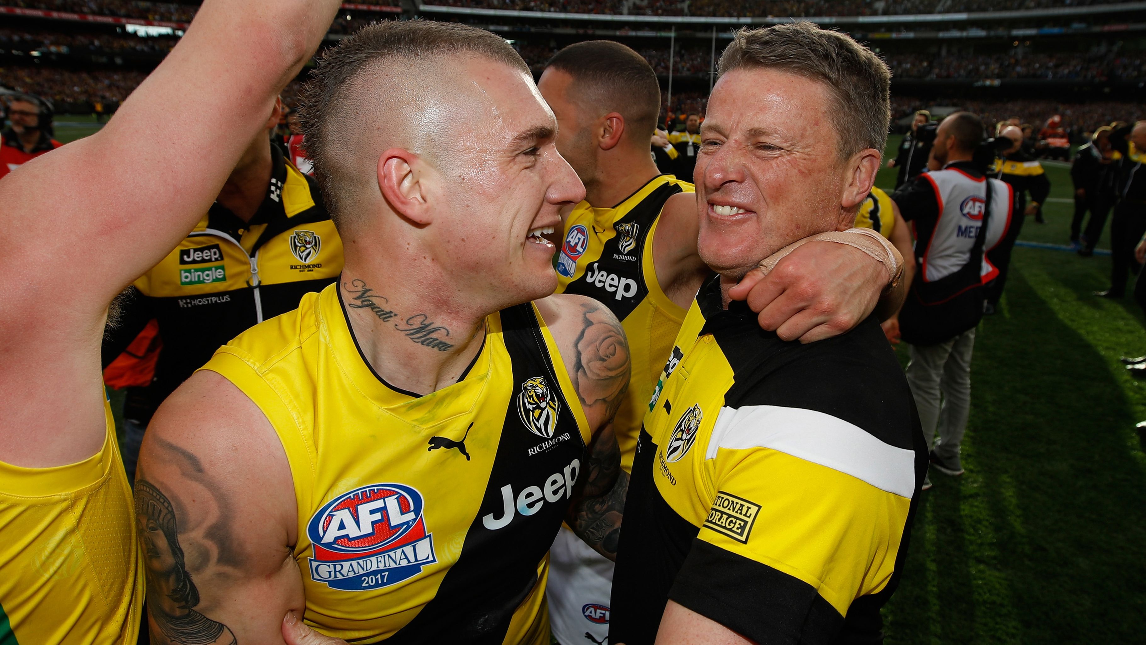 Dustin Martin and Damien Hardwick celebrate Richmond&#x27;s victory in the 2017 AFL grand final.