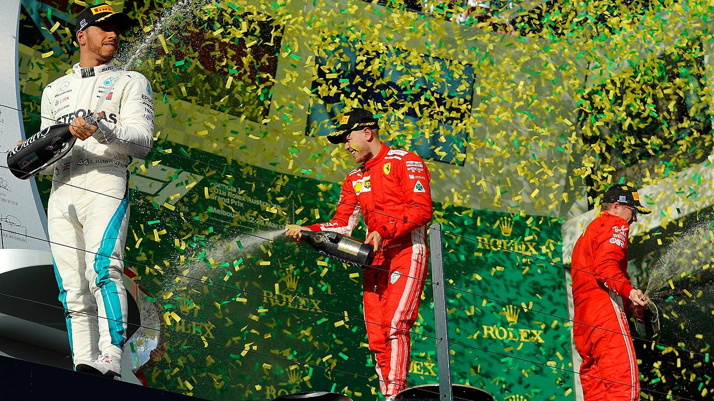German driver Sebastian Vettel of Ferrari(centre) celebrates winning the Formula 1 2018 Australian Grand Prix