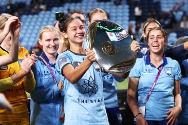 Indiana Dos Santos holds aloft the Premier&#x27;s Plate after the round 20 A-League Women&#x27;s match between Sydney FC and the Newcastle Jets.