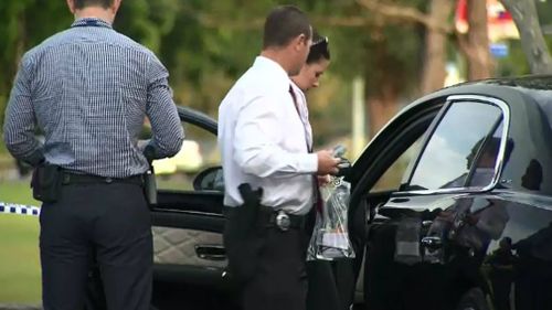 Police search the victim's Bentley. Picture: 9NEWS