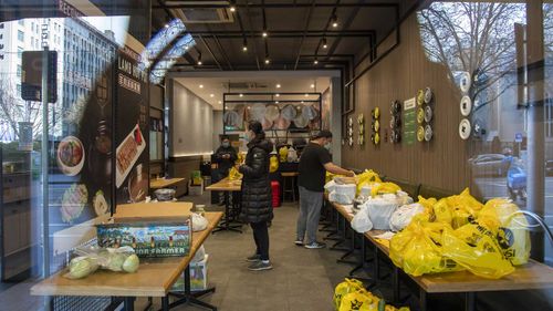 A restaurant prepares delivery meal orders during lockdown in Melbourne.