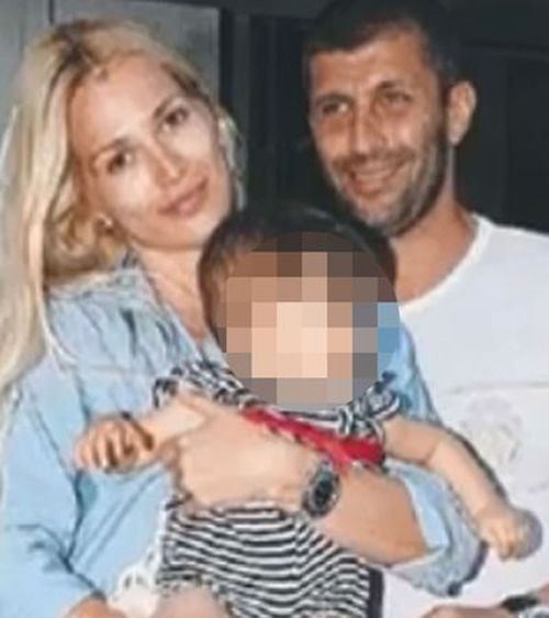 Macris and Viktoria with one of their two children. They led a quiet life, she said.