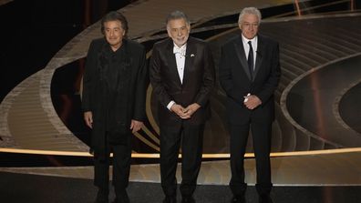 Al Pacino, from left, Francis Ford Coppola and Robert De Niro appear on stage during a "Godfather" reunion at the Oscars.