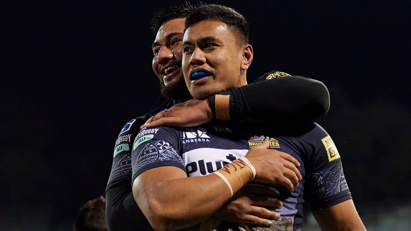 Len Ikitau of the Brumbies celebrates with team mates after scoring a try during the round four Super Rugby Trans-Tasman match between the ACT Brumbies and the Hurricanes at GIO Stadium on June 05, 2021 in Canberra, Australia. (Photo by Brett Hemmings/Getty Images)