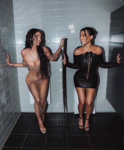Megan Fox and Kourtney Kardashian pose in a toilet block at the Video Music Awards