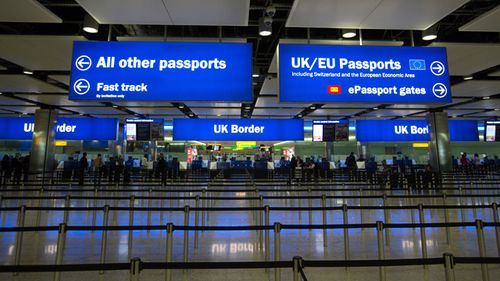 Passengers pass through border controls at Terminal 2, The Queen Terminal, at Heathrow Airport, London.