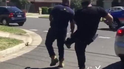 Video captured Paddy (left) being kicked during the alleged road rage incident. (Facebook)