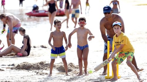 Children play a game of cricket at Bondi Beach on Australia Day in Sydney in 2016. (AAP)