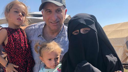 Kamalle Dabboussy with his daughter Mariam Dabboussy and her daughters Aisha and Fatema in al-Hawl camp.