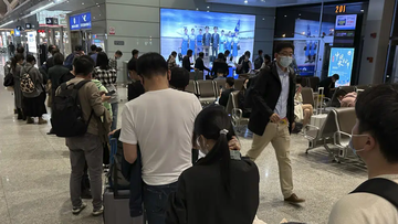 Passengers prepare to board a flight at the airport in north-central China&#x27;s Jiangxi province on Nov. 1, 2022. The Chinese government said Tuesday, Dec. 27 it will start issuing new passports as it dismantles anti-virus travel barriers, setting up a potential flood of millions of tourists out of China for next month&#x27;s Lunar New Year holiday.