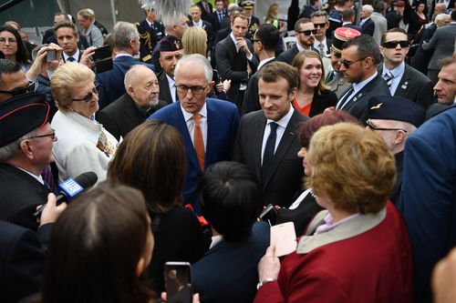 President Macron with Prime Minister Malcolm Turnbull after the event. Picture: AAP
